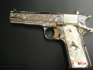 Colt-1911-45acp-fully-refinished-in-nickel-with-24k-gold-accents-master-engraved-by-S-leis-certifica_101195261_621_17870A1B5D6A98E6.jpeg.jpg